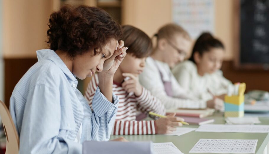 A Group of Kids Sitting at a Desk in a Classroom Free Stock Photo by Everypixel
